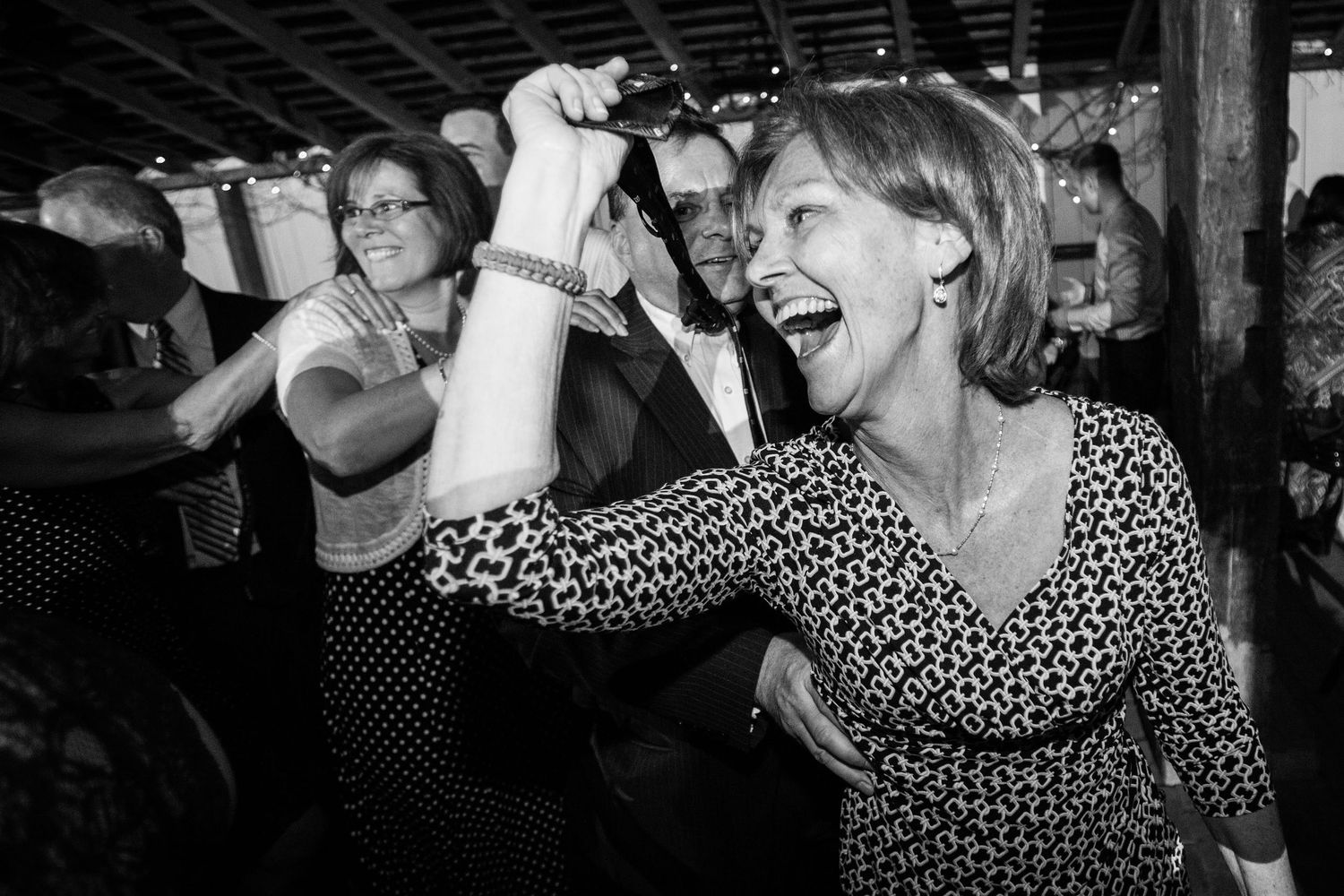 Two figures dancing with joy and excitement at a lively celebration.