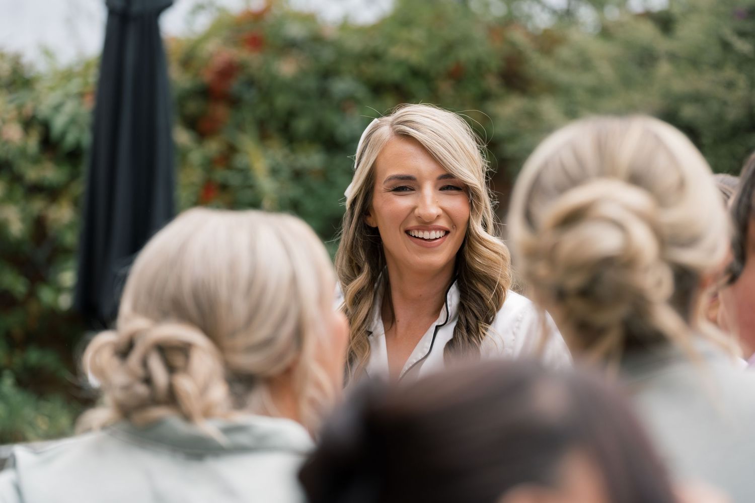 Wedding guests enjoying a celebration outdoors.
