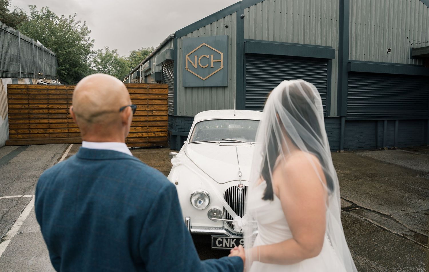 A collage of wedding photos showing outdoor venue details and guests gathered at an industrial-style location.