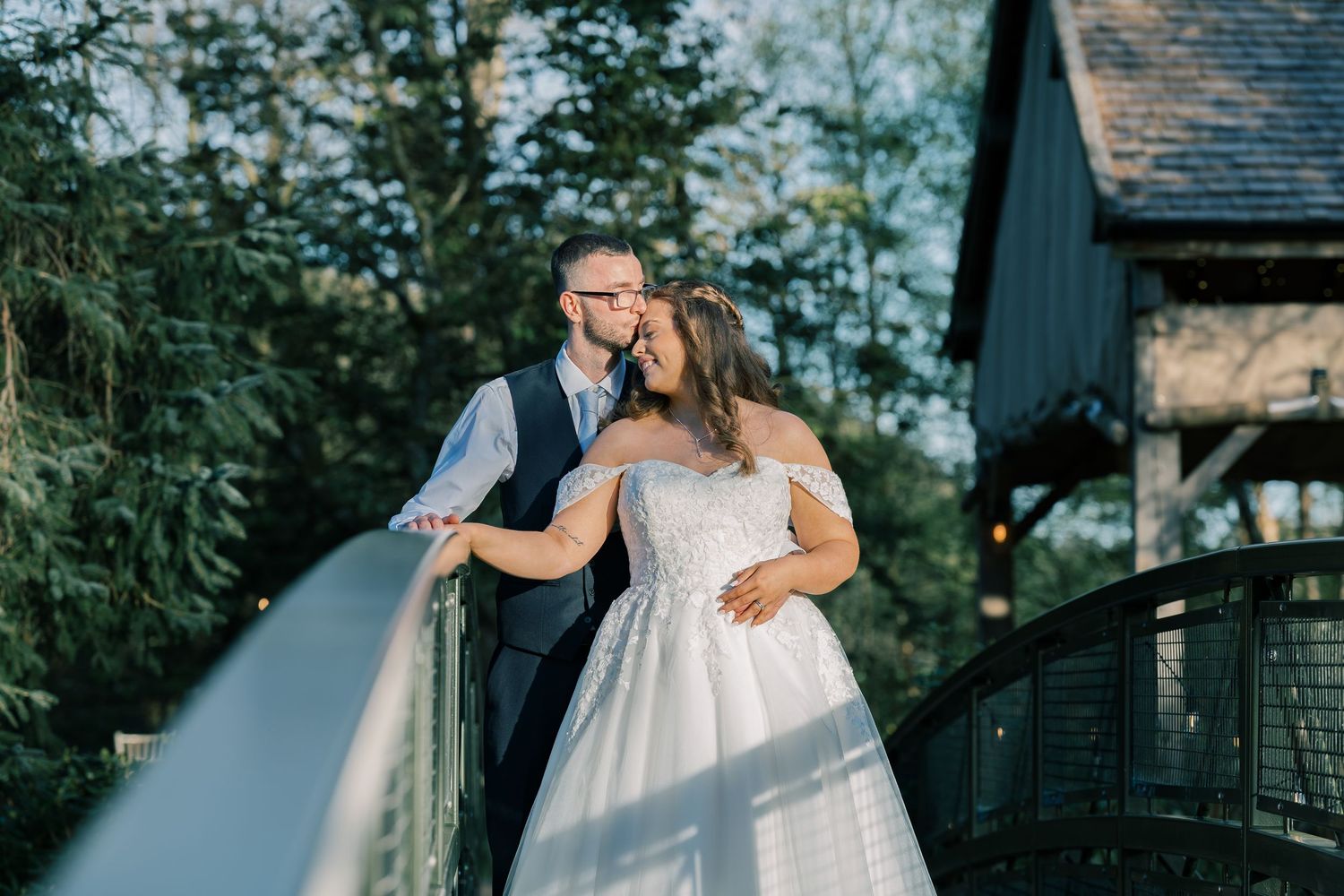 A couple in wedding attire shares romantic moments at Hackness Grange Wedding Venue, Scarborough.