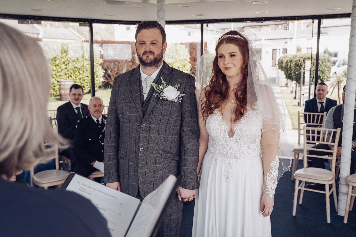 Bride and groom share a joyful moment during their outdoor wedding ceremony at Kings Croft Hotel, Pontefract.