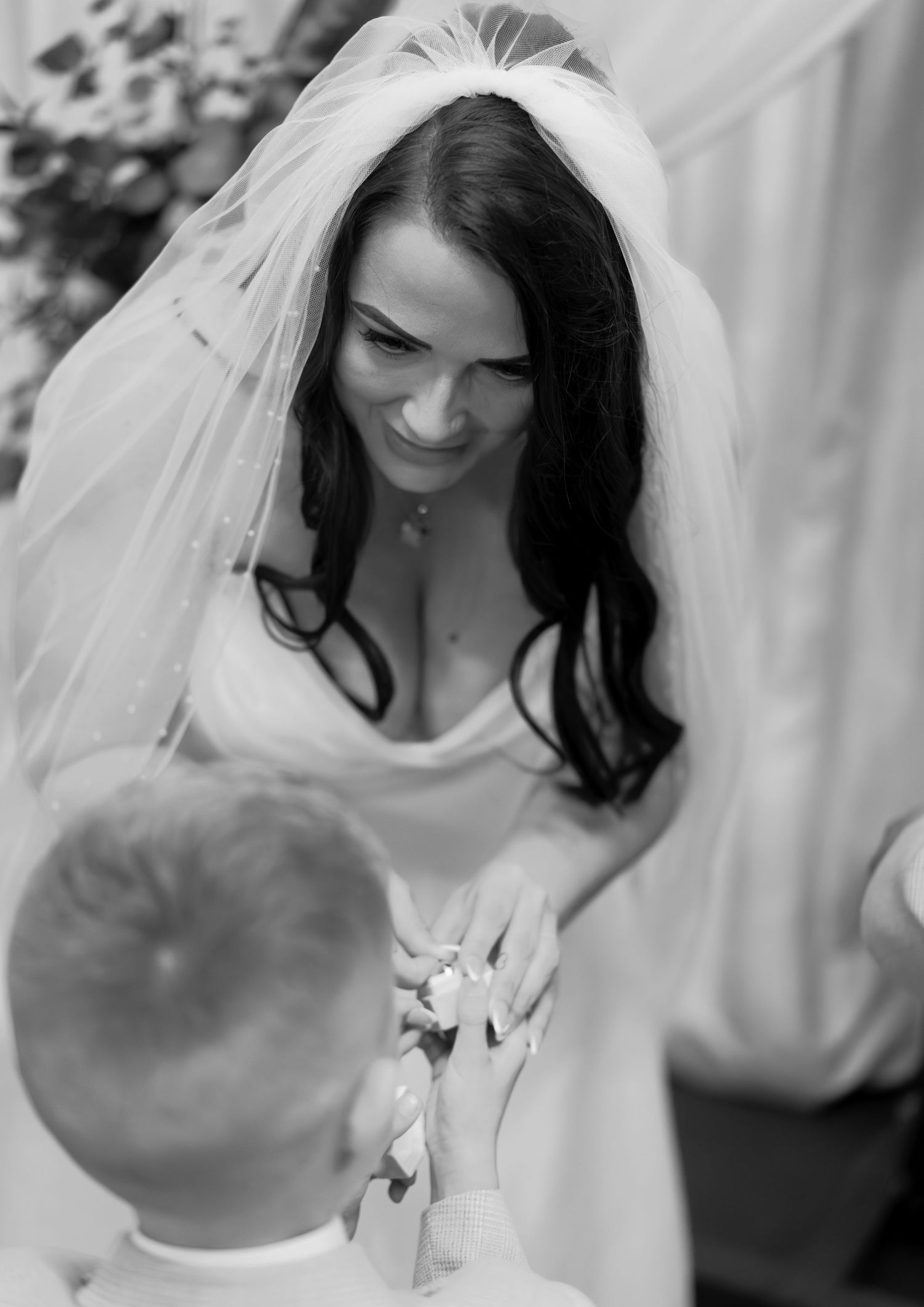 Black and white photos capturing candid moments during a wedding celebration.