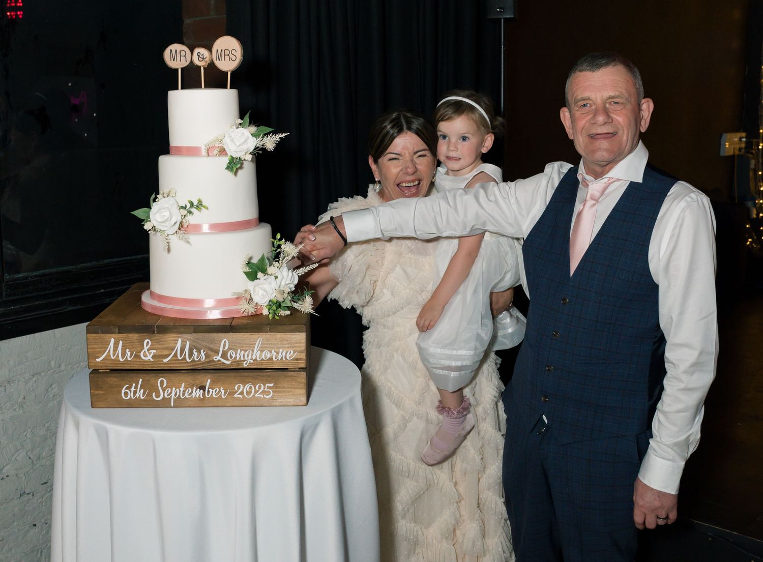 Wedding cake cutting ceremony captured in sequence of evening reception photos.
