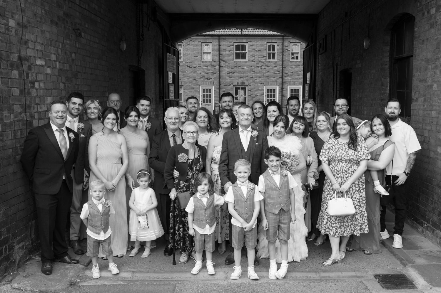 A collection of vintage black and white photographs showing groups of children and adults arranged in formal poses.