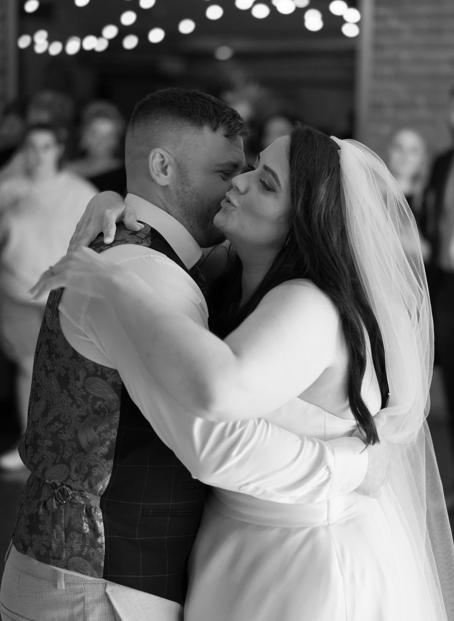 A sequence of romantic black and white wedding dance photos showing intimate moments on the dance floor.