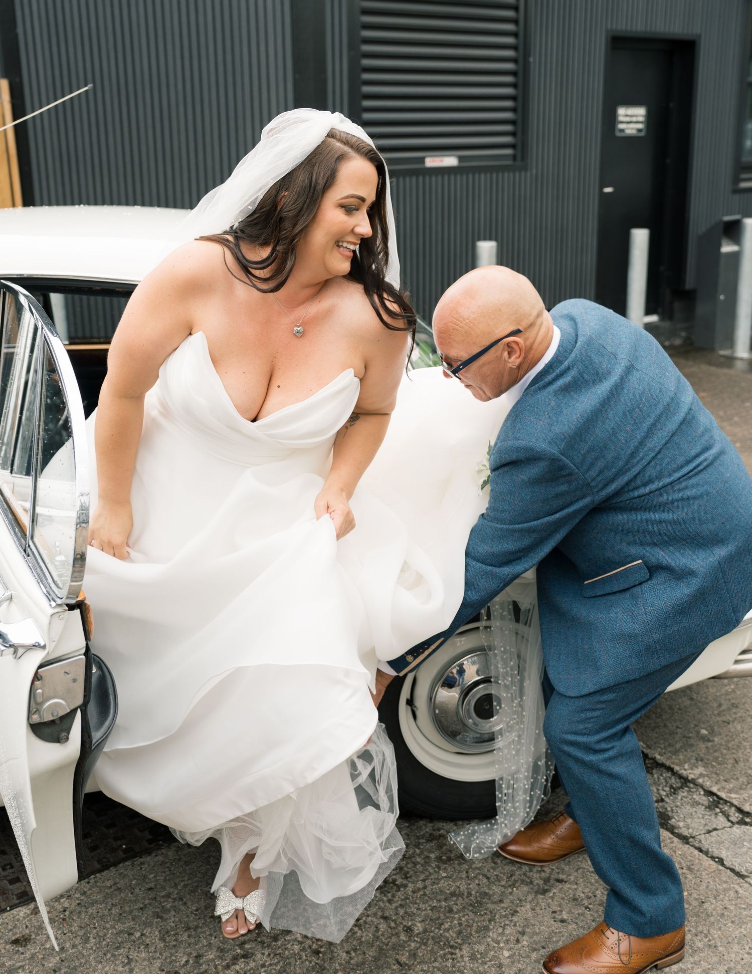 A series of photos showing a couple outside a building helping with a wedding dress.