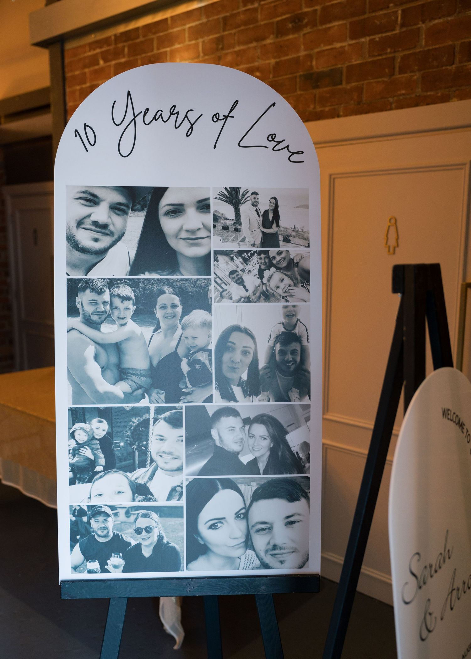 A photo collage display board with '10 Years of Love' text featuring multiple black and white relationship photos on an easel.