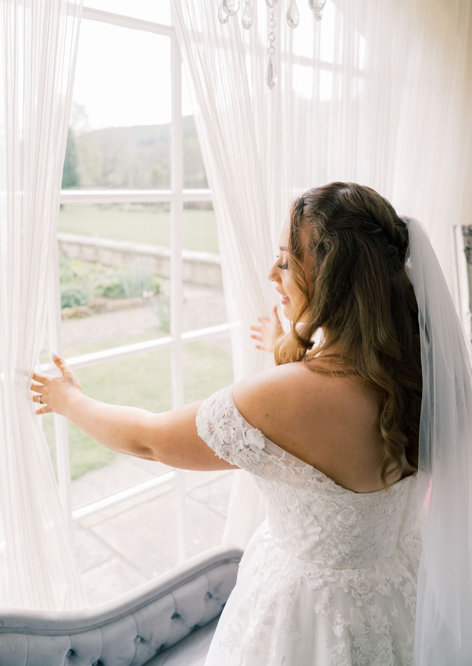 A dreamy sequence shows someone in a white lace wedding dress standing by sunlit windows with flowing curtains.