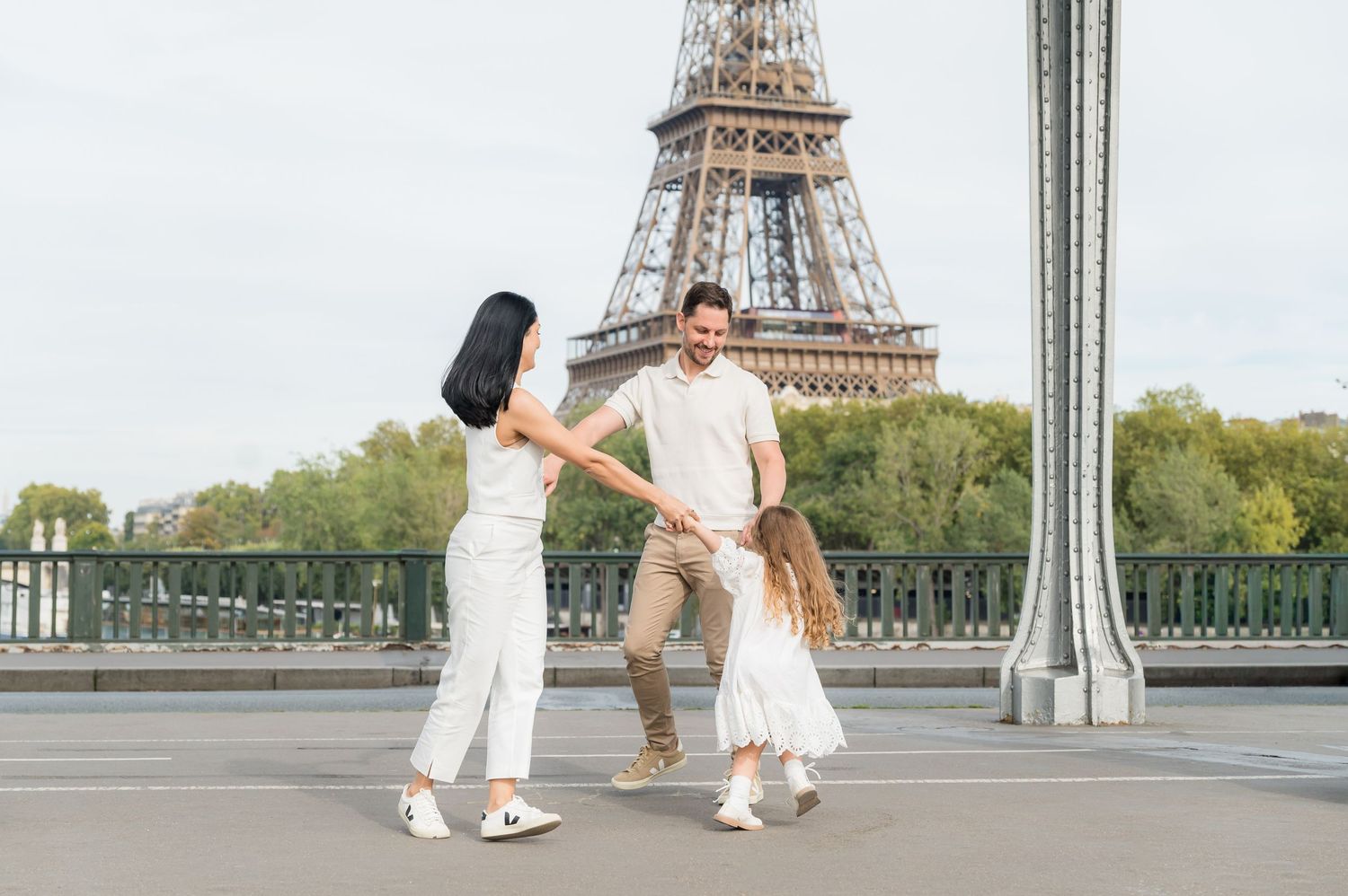 A series of romantic couple photos taken at different angles in front of the iconic Eiffel Tower in Paris.