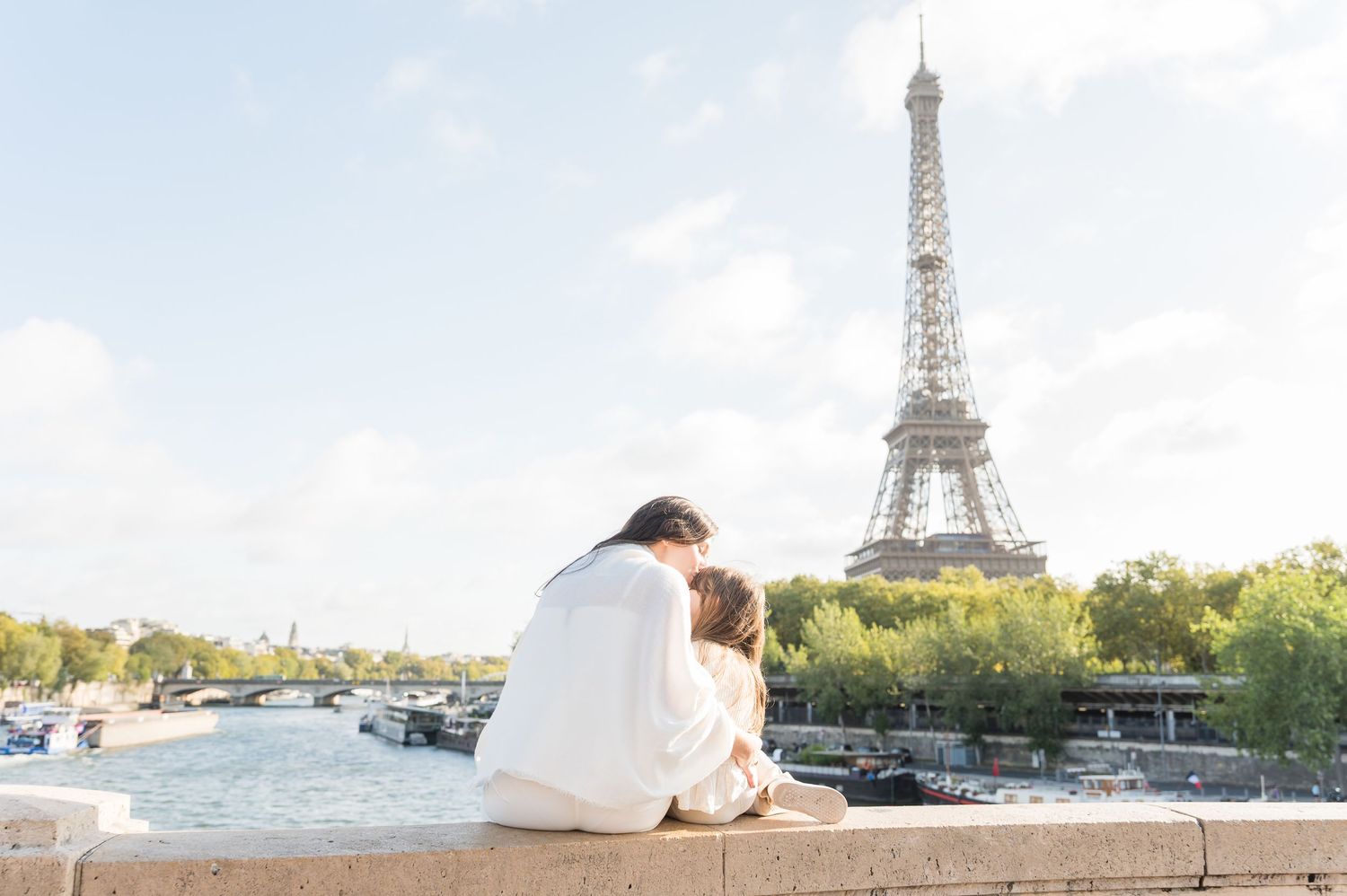 Three scenic photos of Paris landmarks including the Eiffel Tower under bright blue skies.