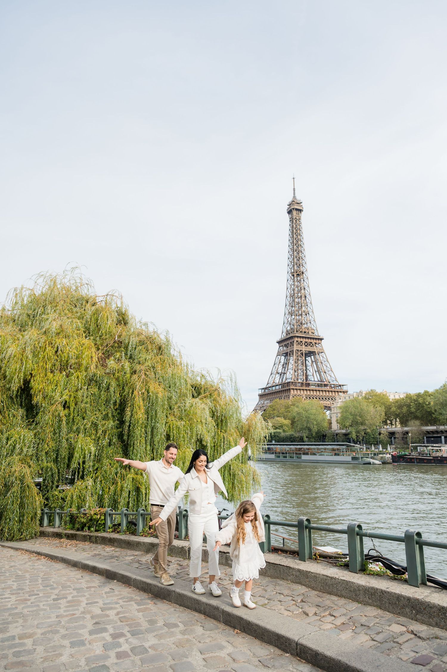 Romantic scene by the Seine River in Paris with the iconic Eiffel Tower visible in the background across multiple photos.