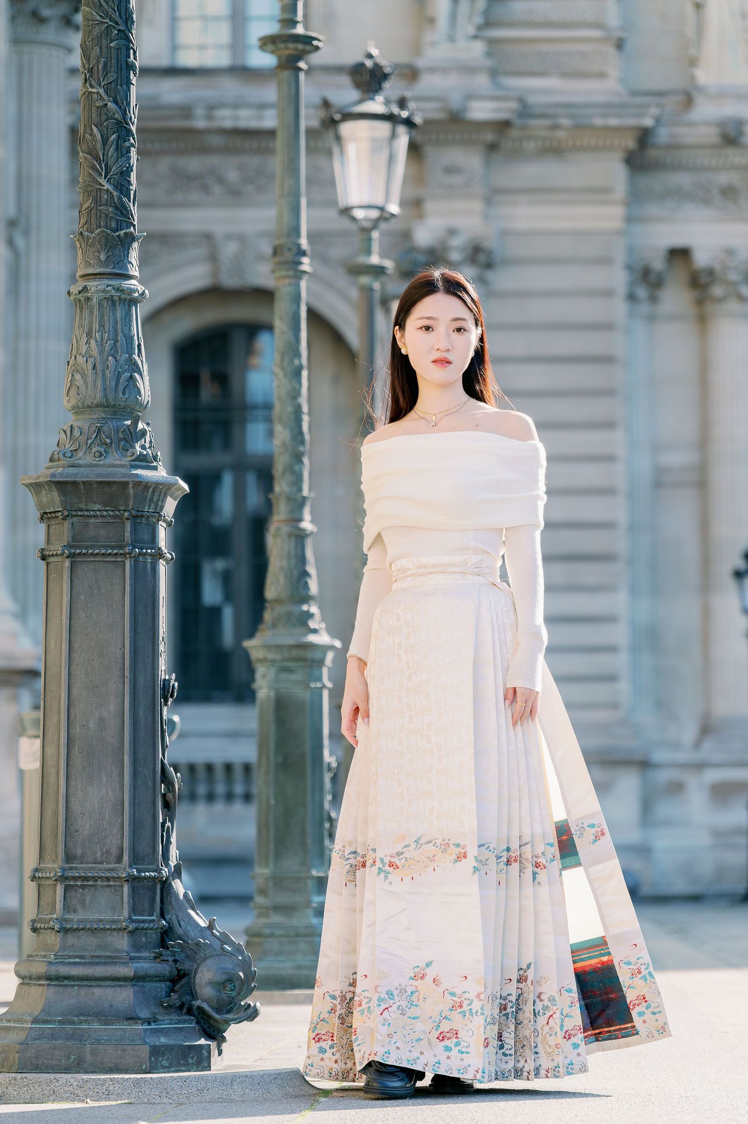 Vintage-inspired dress photographed near ornate streetlamp and classical architecture.