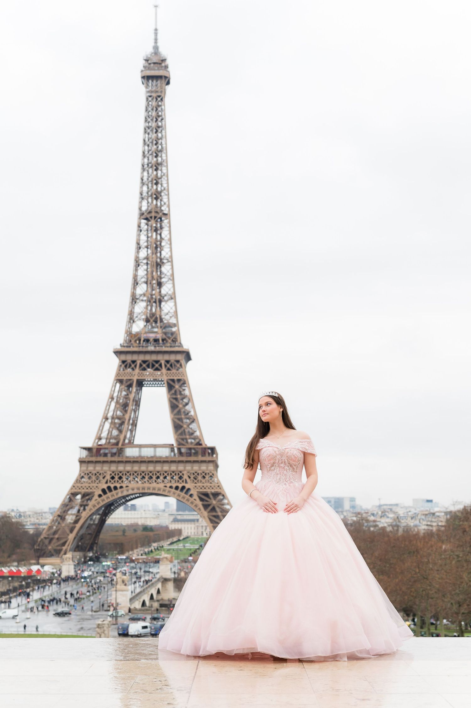 A series of romantic photos showing a pink ballgown against the iconic Eiffel Tower backdrop in Paris.