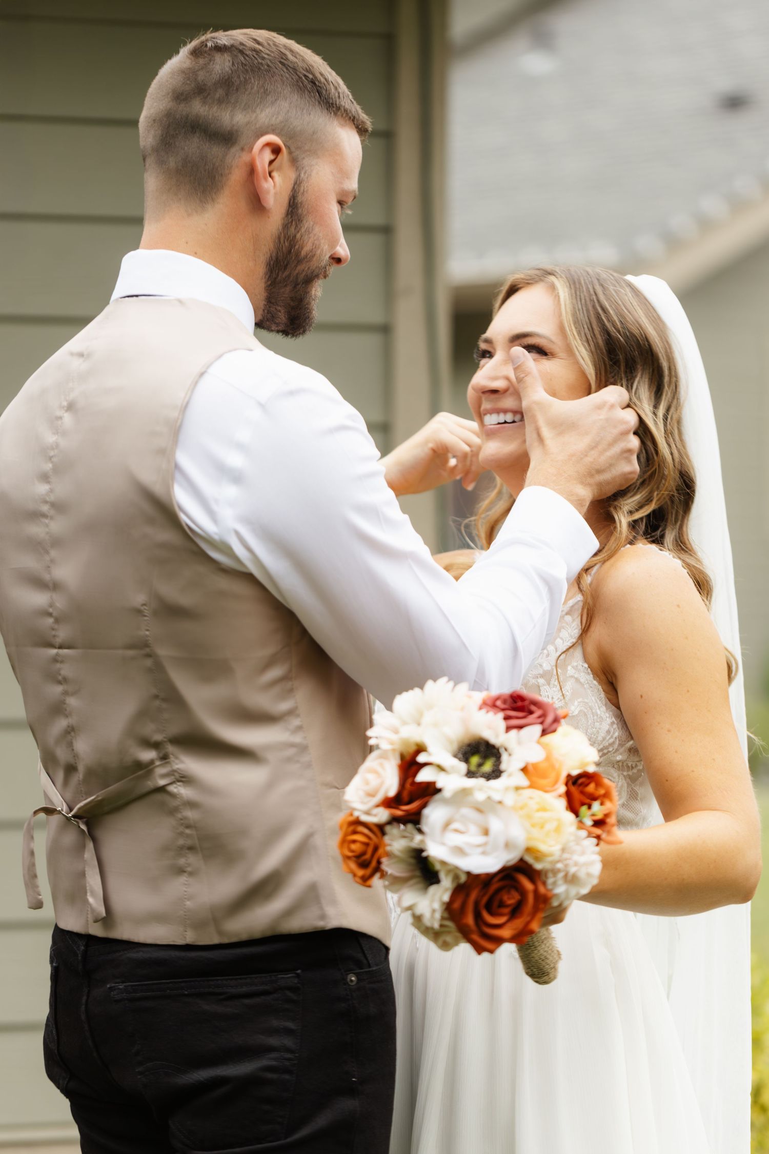 A sequence of romantic moments between a couple in wedding attire sharing an intimate dance.