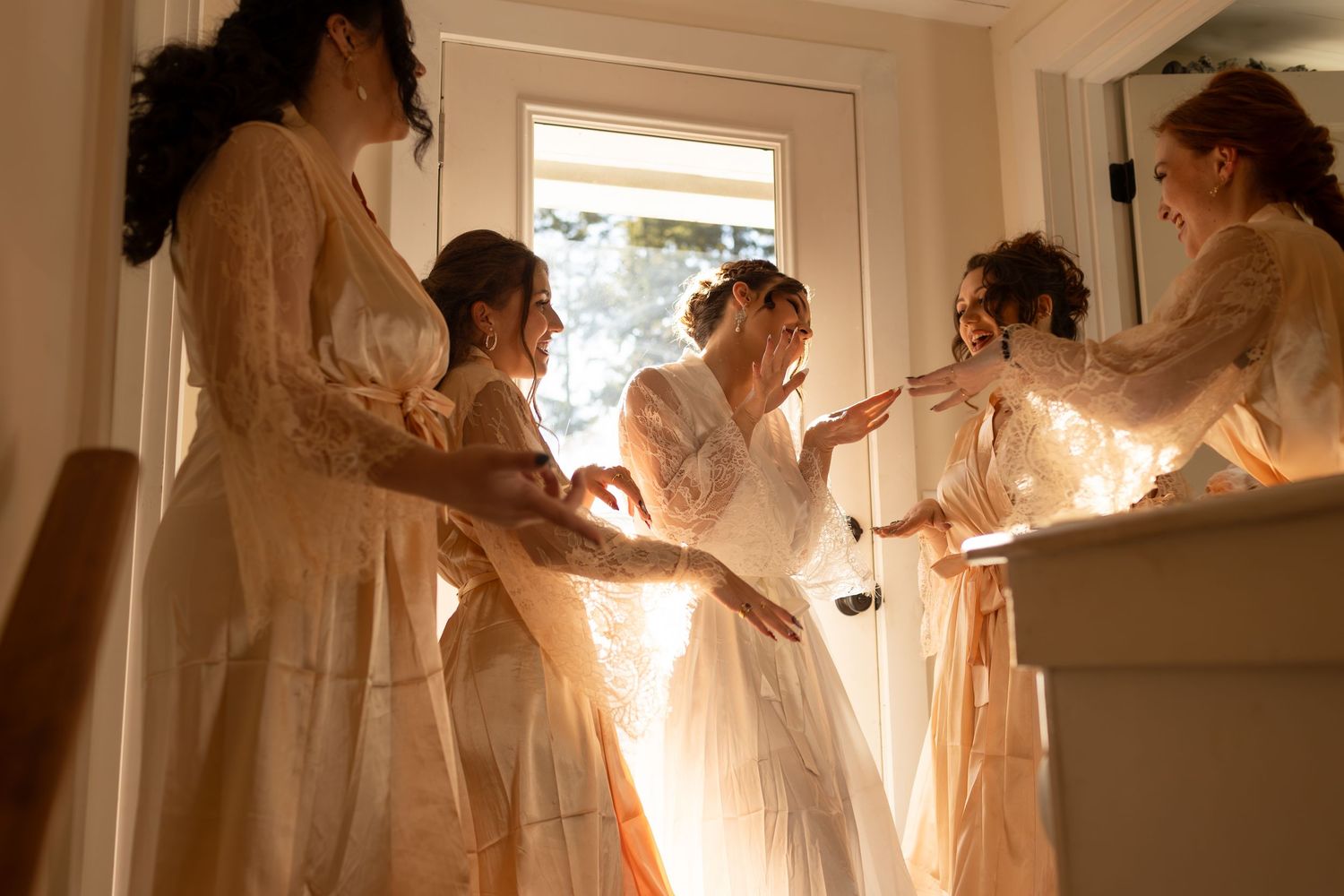 Series of ethereal bridal portraits with flowing white dresses in soft indoor lighting.