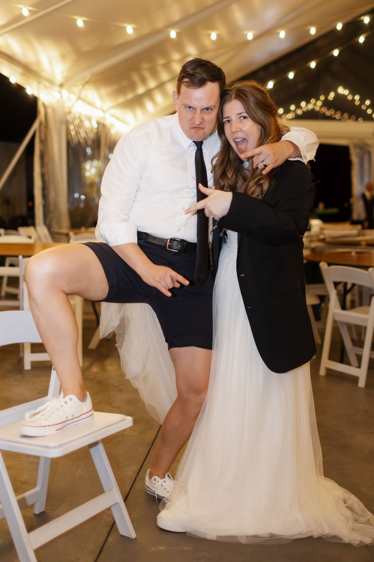 A romantic wedding reception sequence showing couples dancing under twinkling lights in a white tent venue.