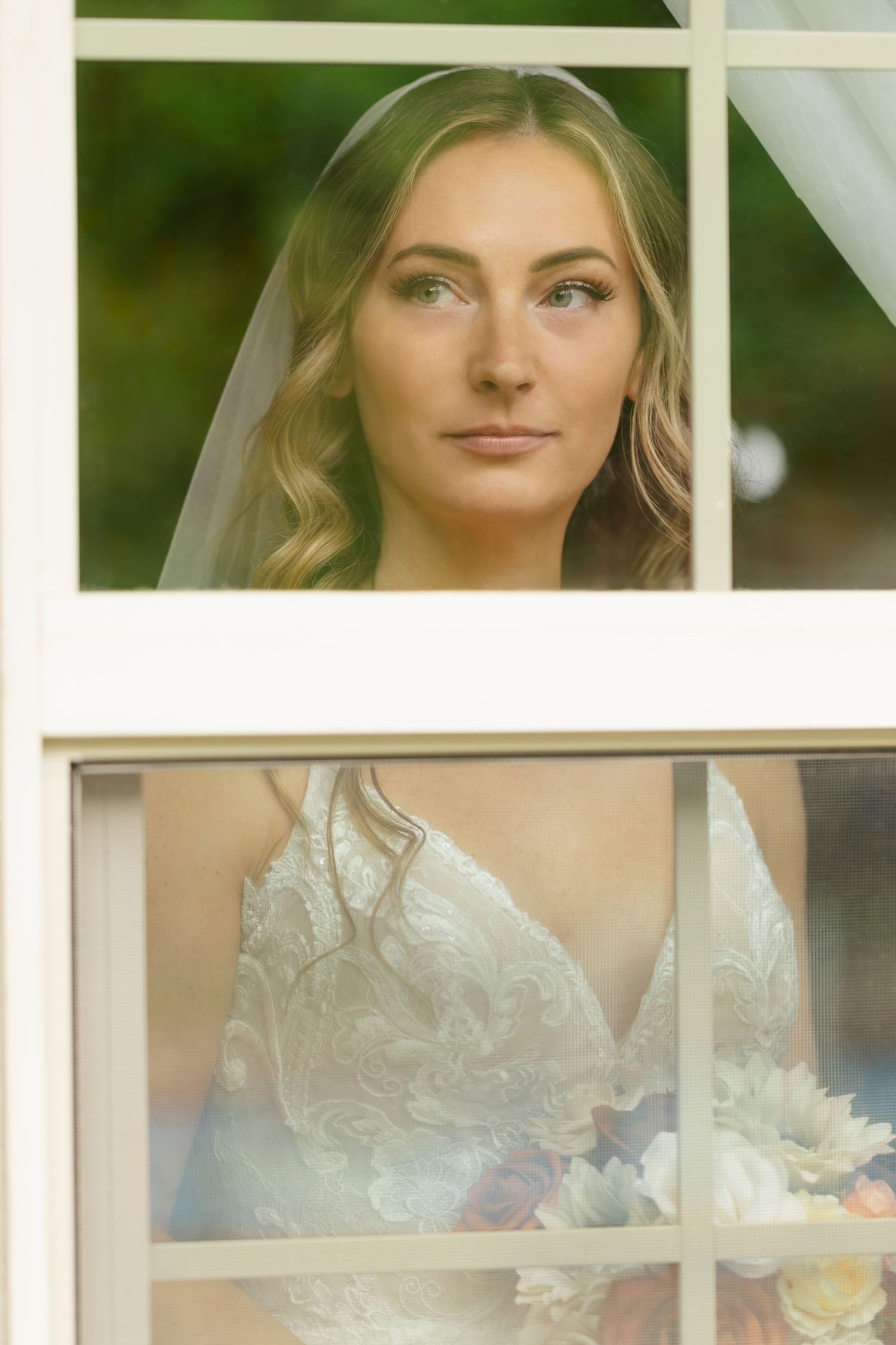 A bridal portrait series showing close-up details of a white lace wedding dress and romantic styling in natural light.