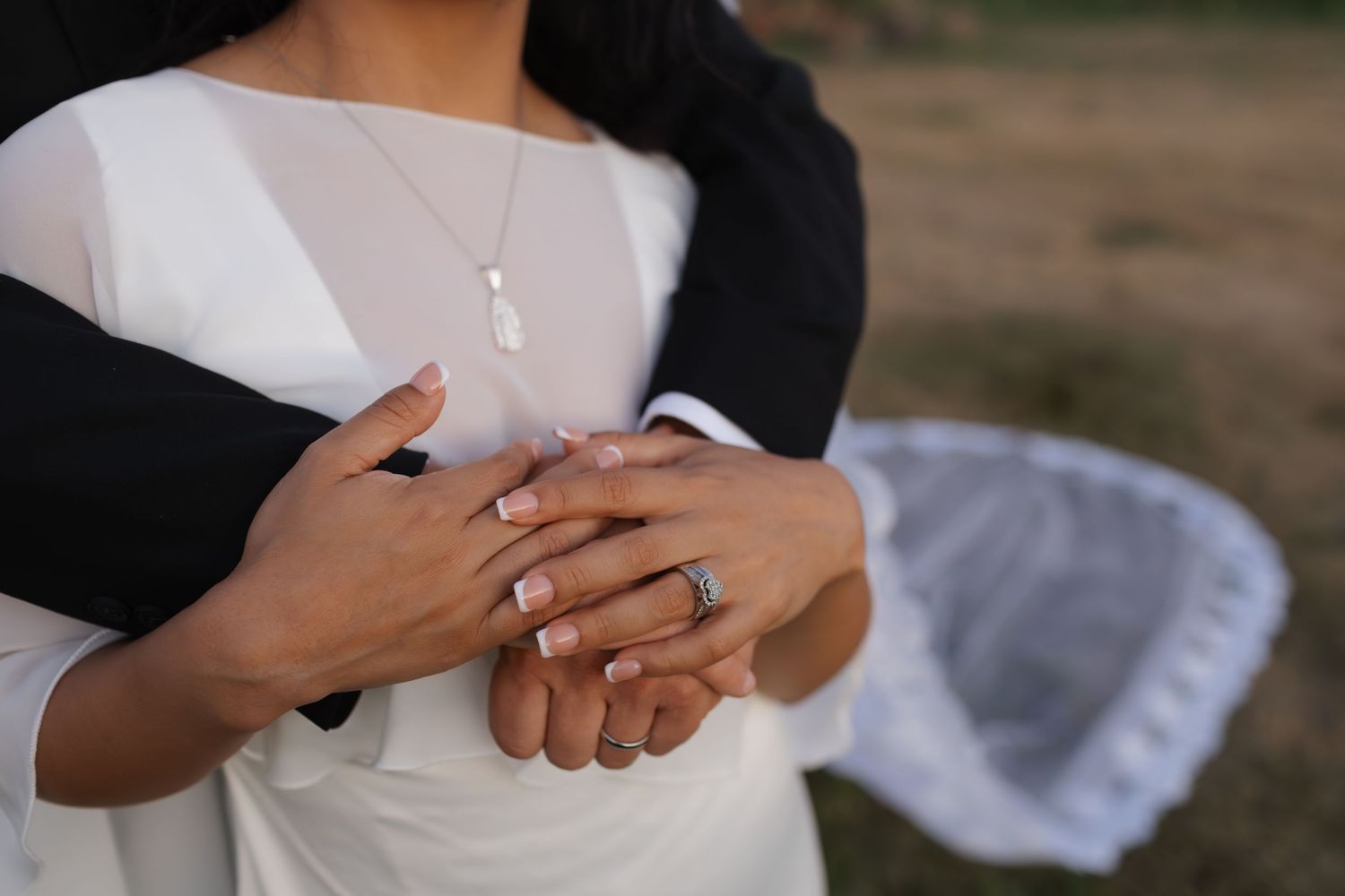 Close-up shots of hands and rings during intimate wedding moments.