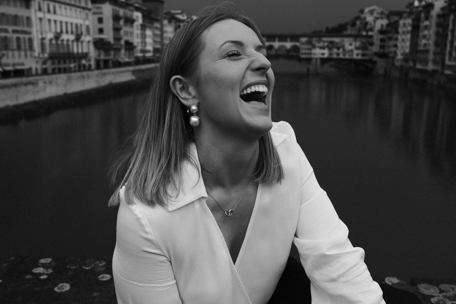 A series of black and white candid moments showing joyful laughter and expressions.