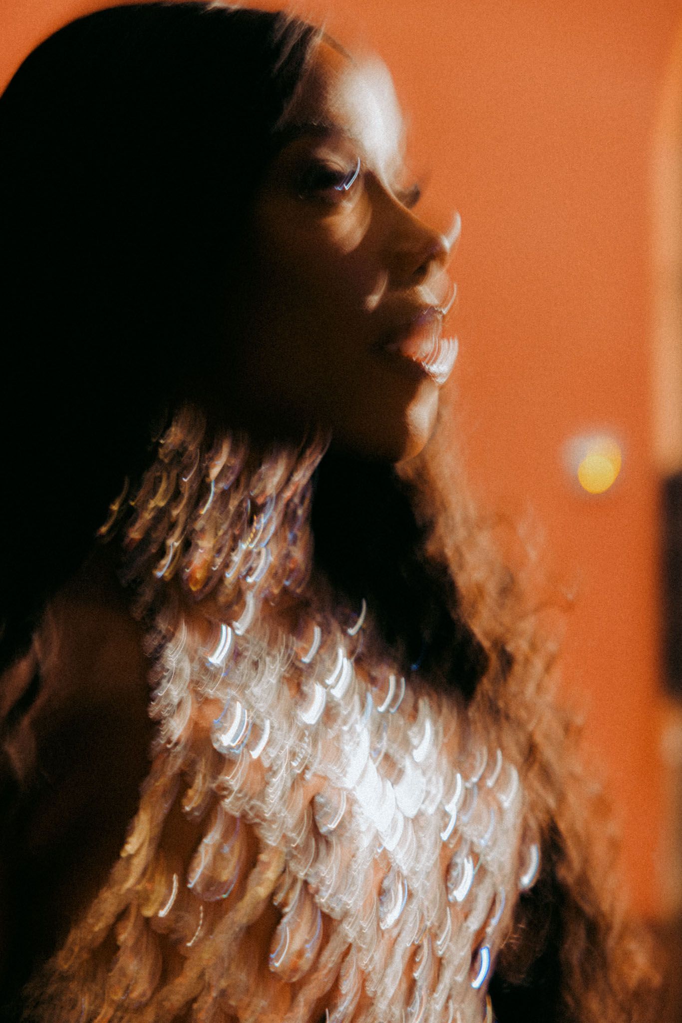 Abstract motion blur photography with orange lighting creates a dreamy artistic effect.