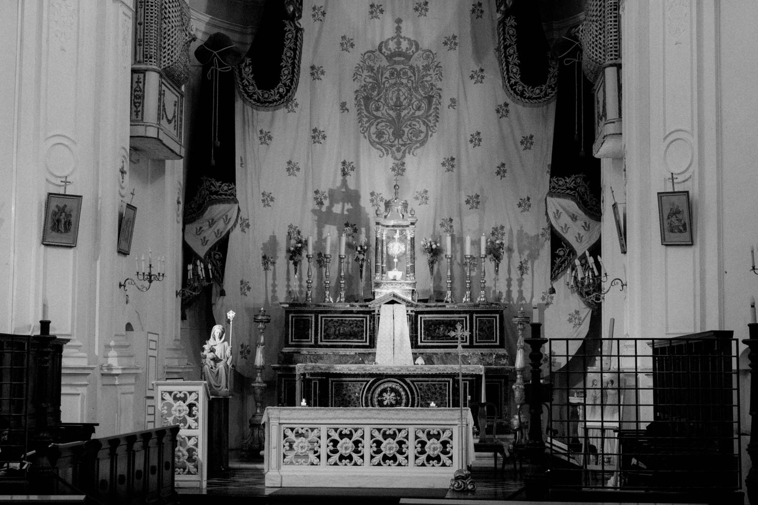 Interior view of an ornate church sanctuary with decorative walls and architectural details.