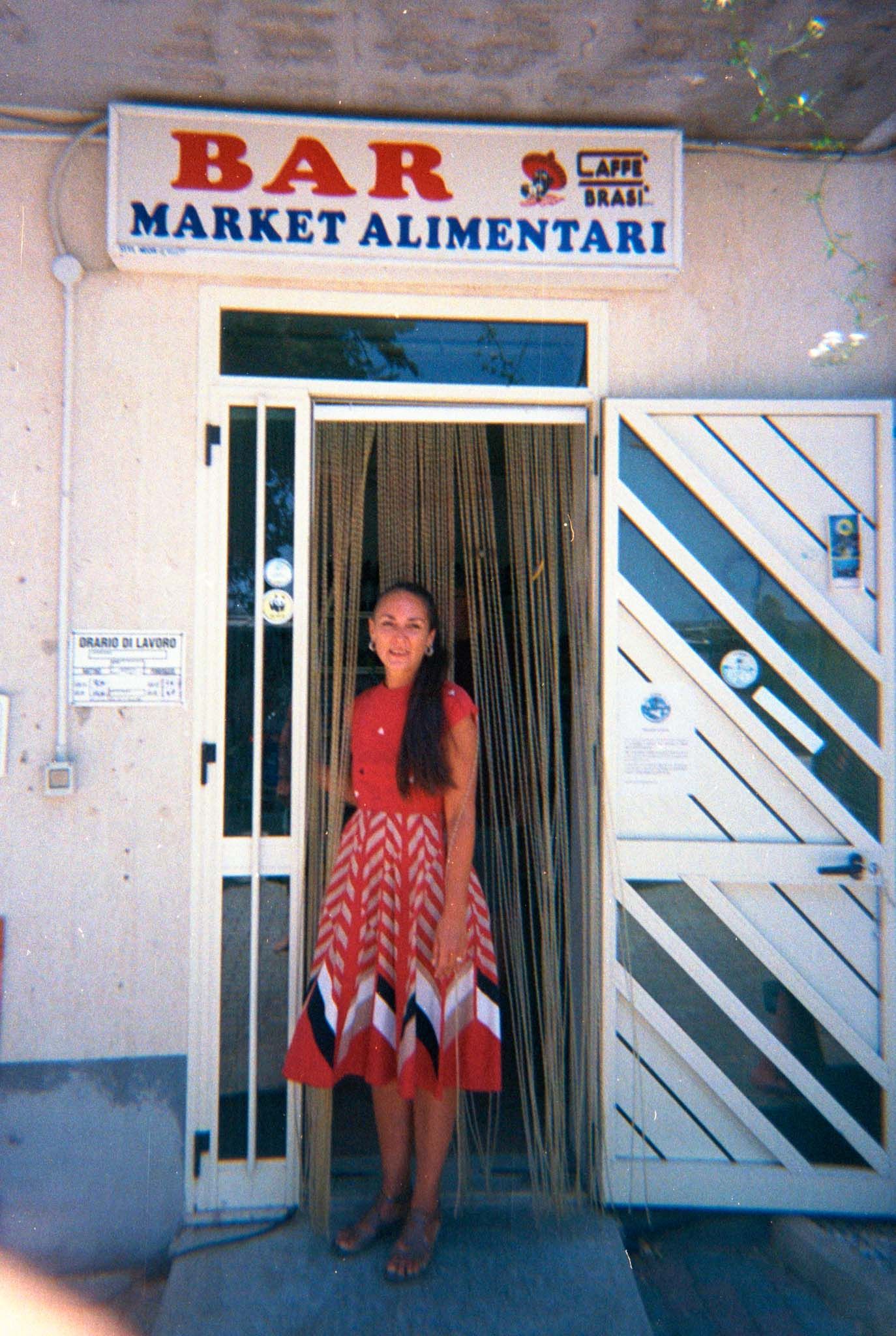 A sequence of four similar photos showing a storefront entrance with 'BAR MARKET ALIMENTARI' signage and white walls.