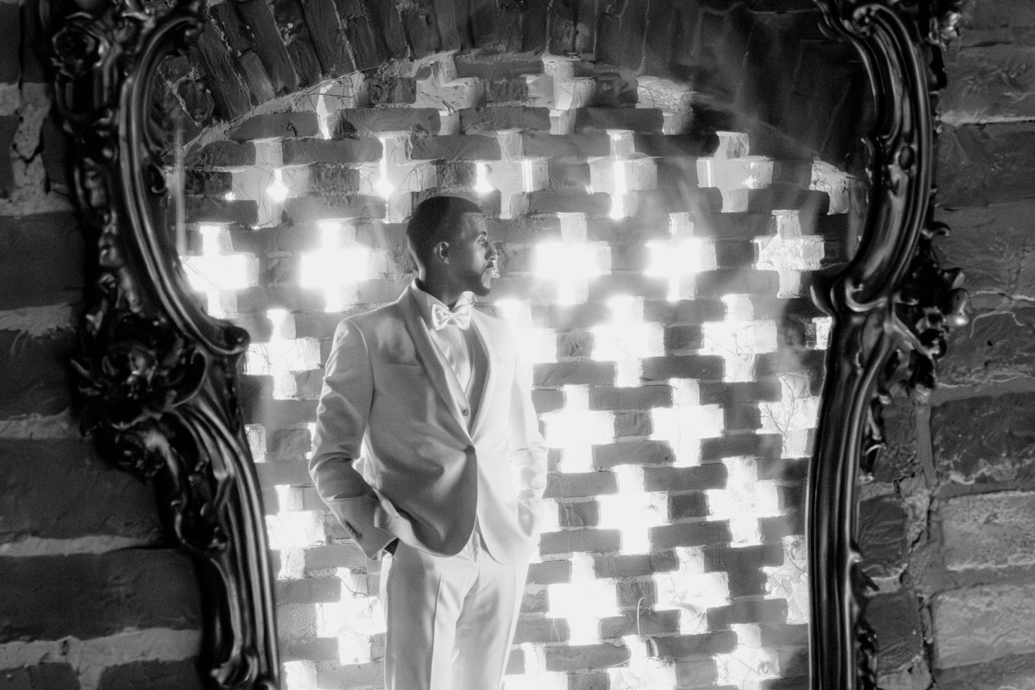 A sequence of black and white photos shows someone walking through an ornate doorway with illuminated cross patterns.