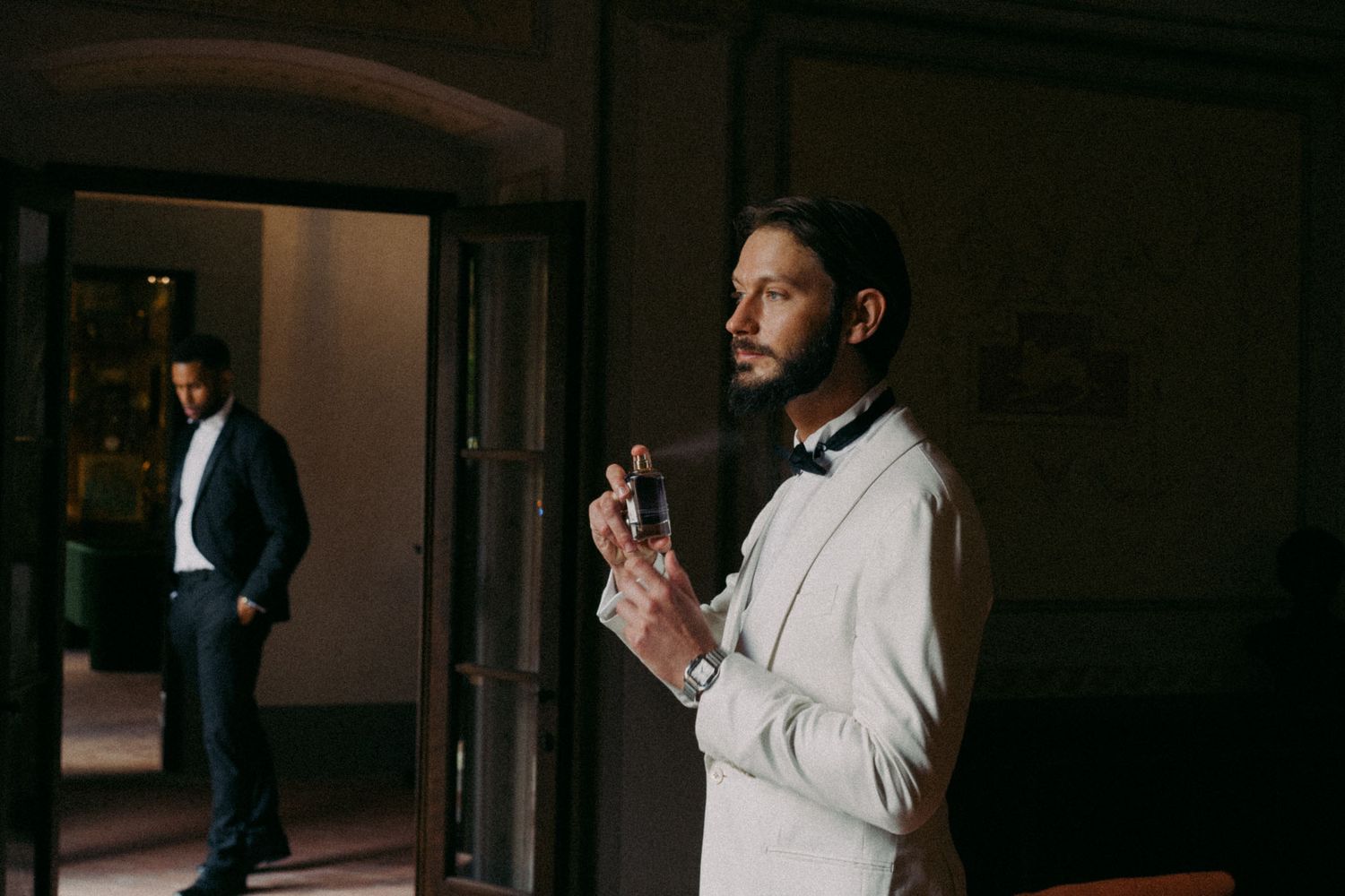 A series of photos showing a person in a white dress shirt adjusting their tie and preparing for a formal event.