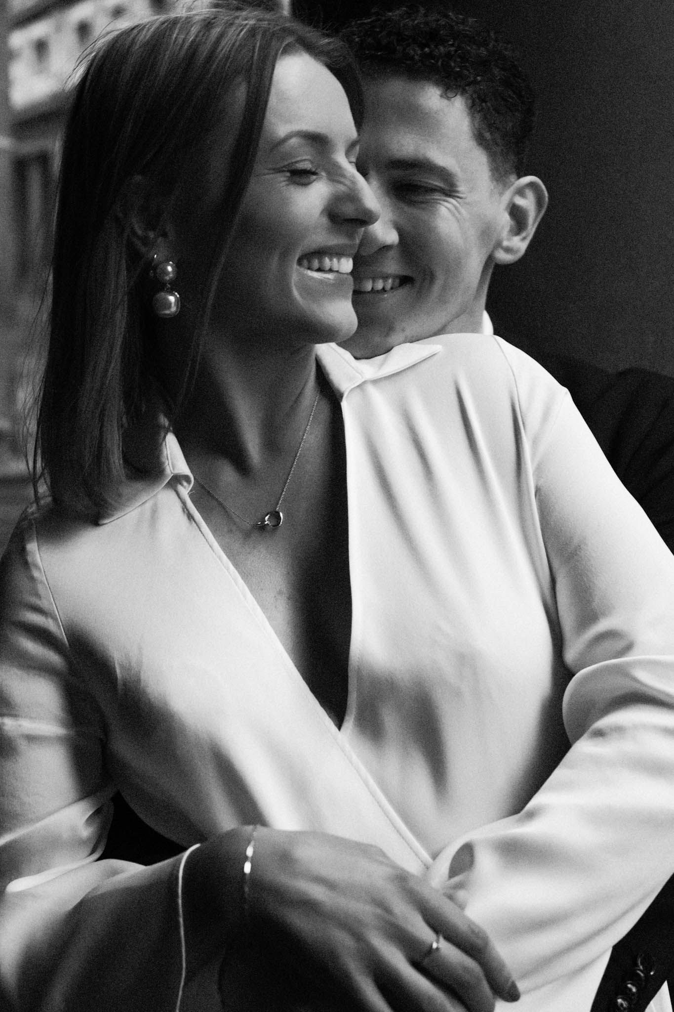 A romantic black and white photo series showing an intimate couple embracing and smiling in close-up shots.
