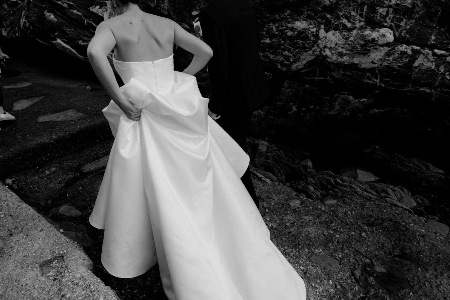 A series of photos showing a white wedding dress with a flowing skirt against a dark outdoor background.