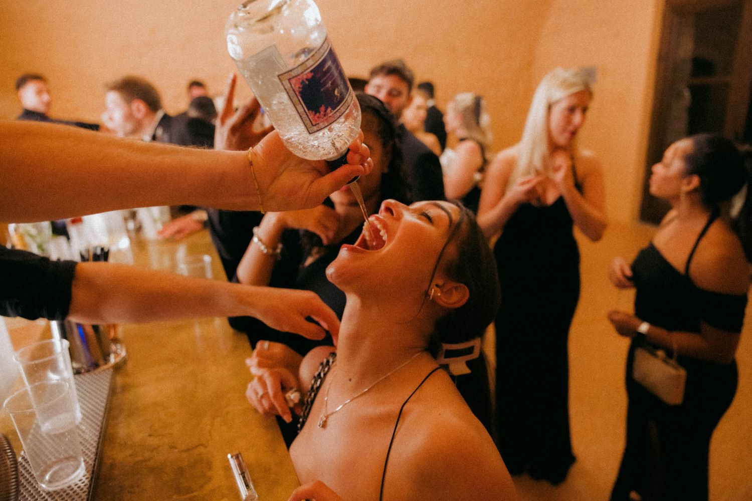 A sequence of wedding reception photos showing guests laughing and enjoying champagne toasts during celebrations.