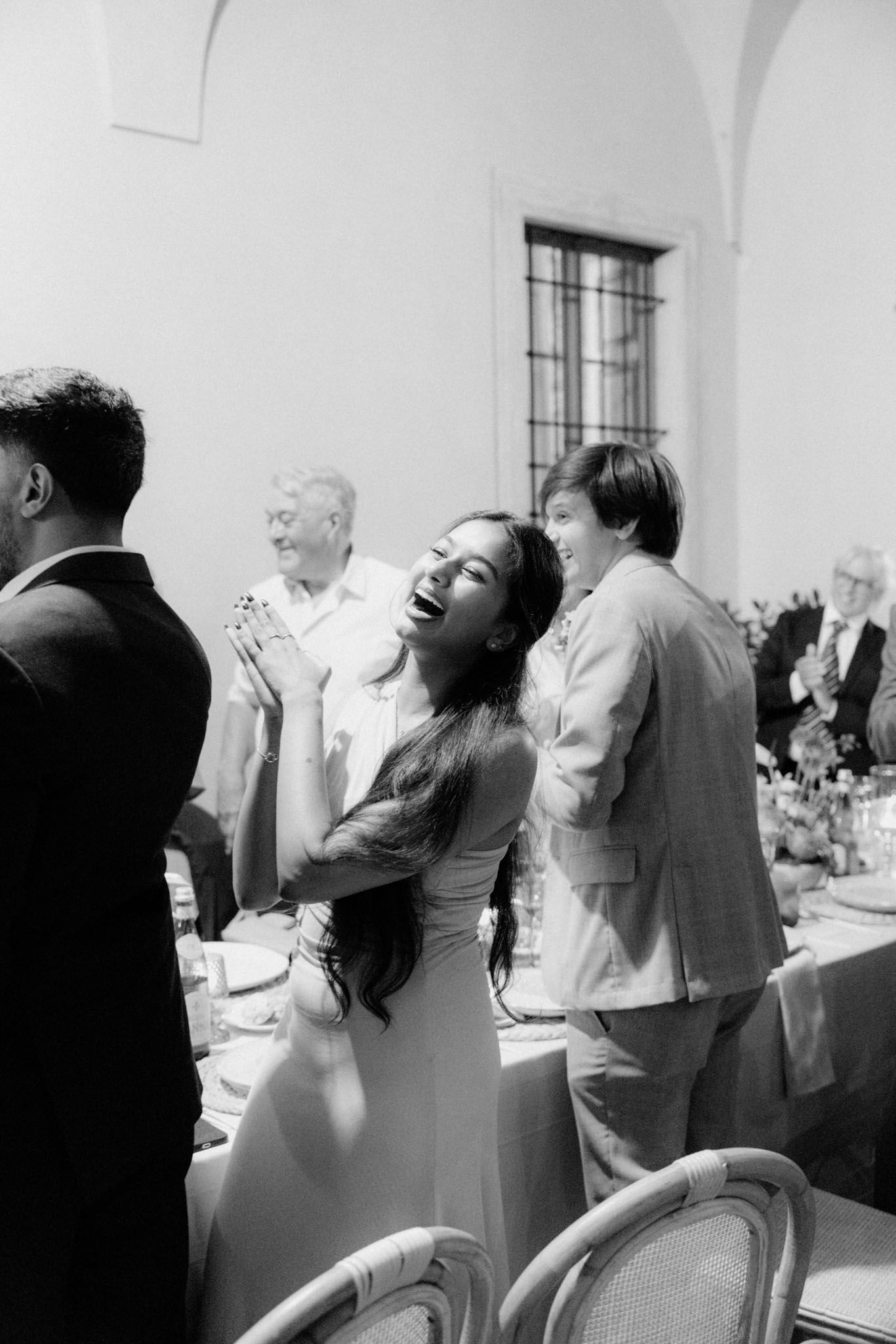 A sequence of black and white photos showing couples dancing and embracing at what appears to be a wedding reception.