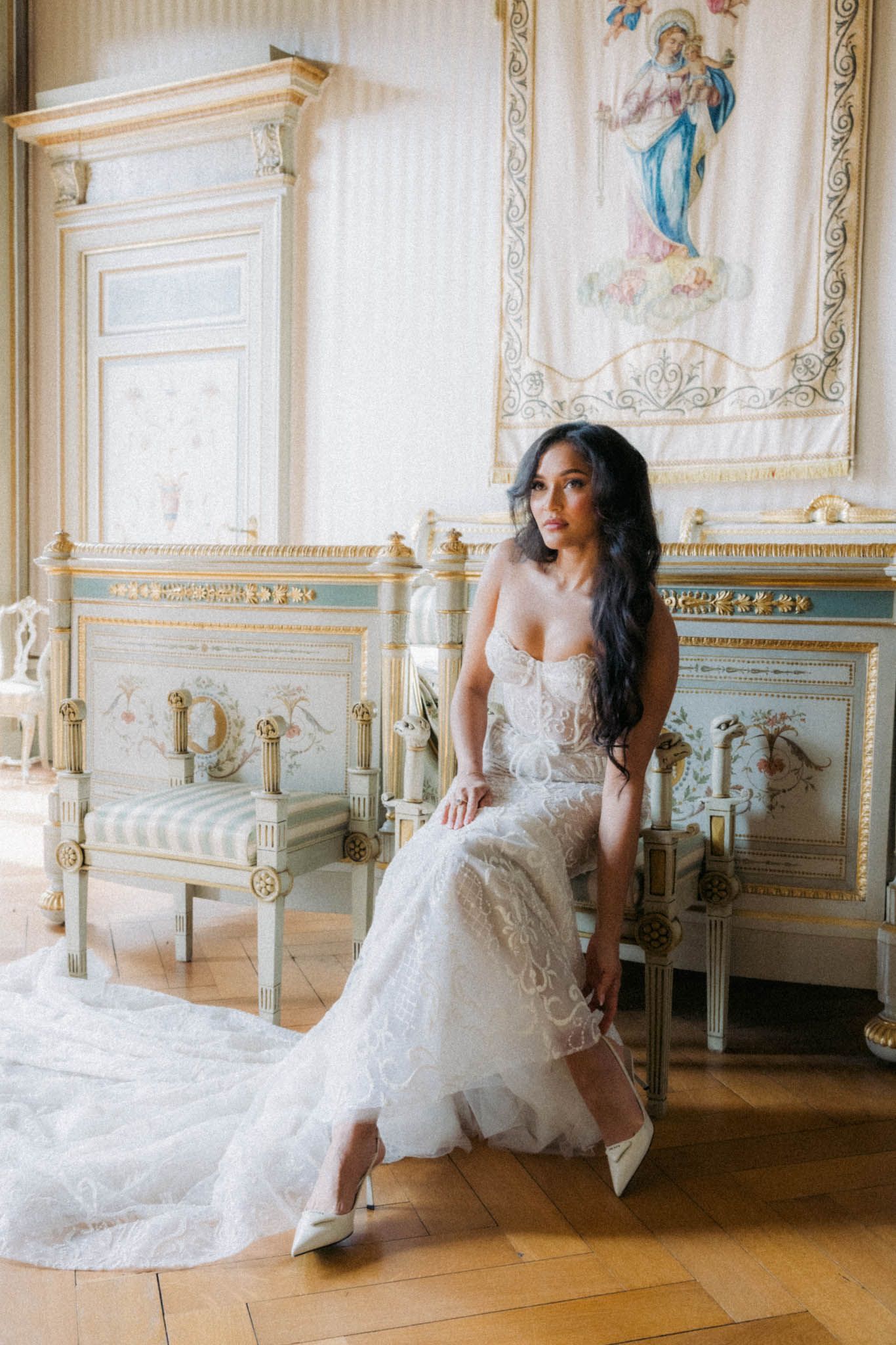 Elegant bridal portraits in a luxurious white and gold baroque style room with ornate architectural details.