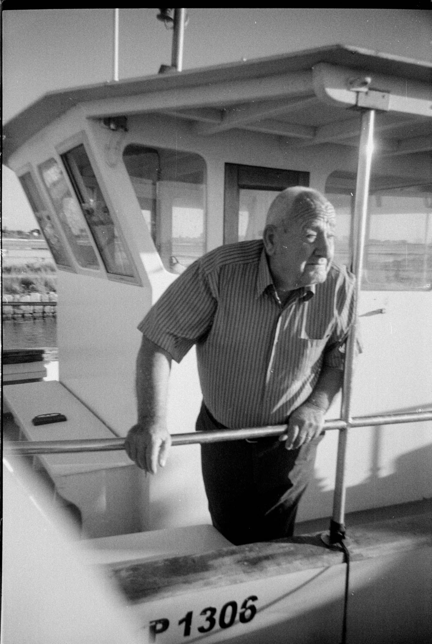 A series of black and white photos showing someone inspecting and examining the exterior of a small aircraft.