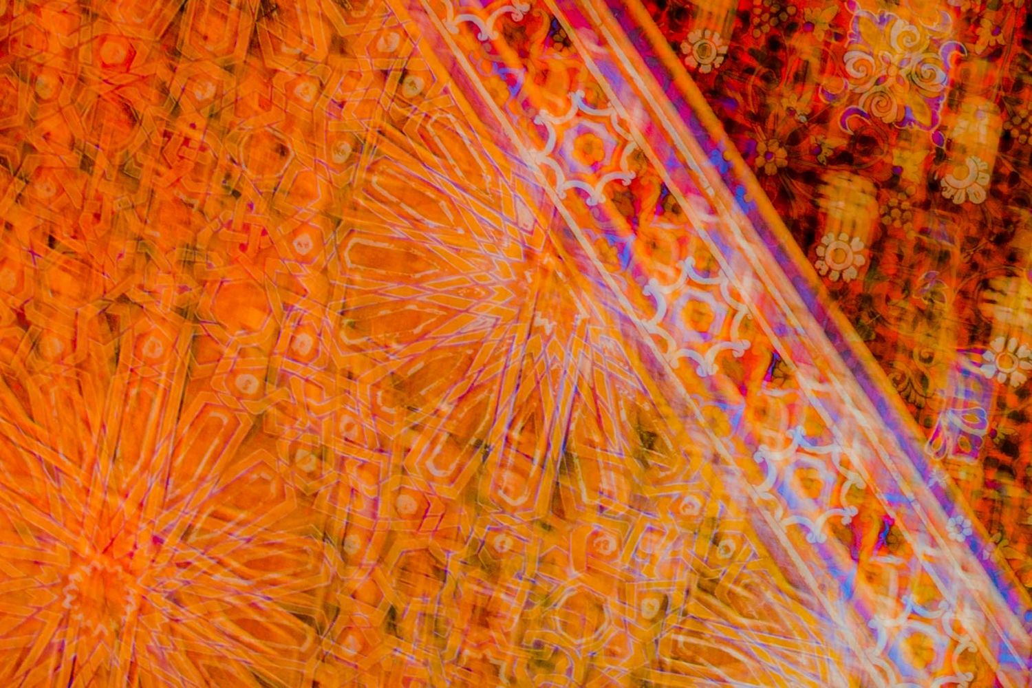 Abstract digital art pattern with glowing orange and blue lines creating a dynamic technological texture.