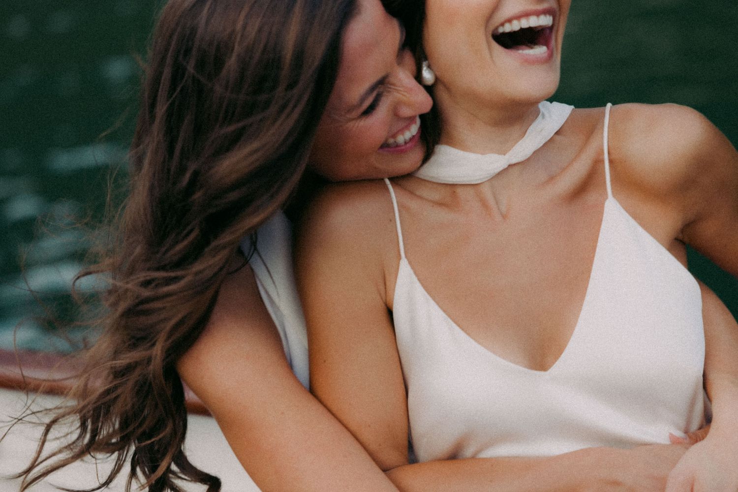 A collection of candid romantic photos showing close-up moments of laughter and intimacy between a couple.