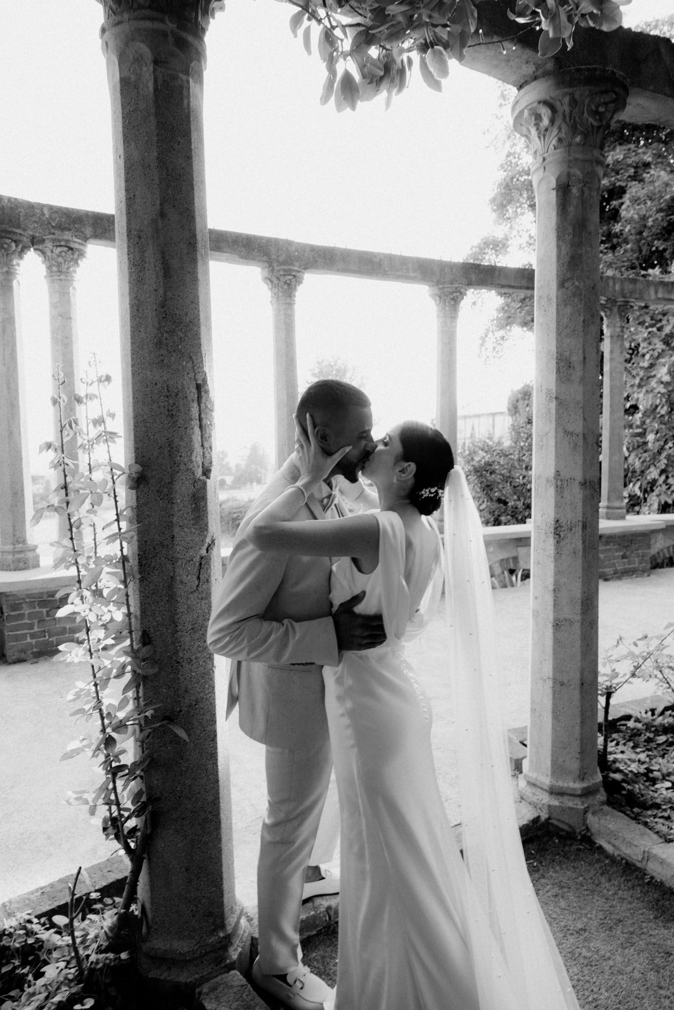 A romantic series of black and white photos showing a couple sharing tender moments on a columned porch.