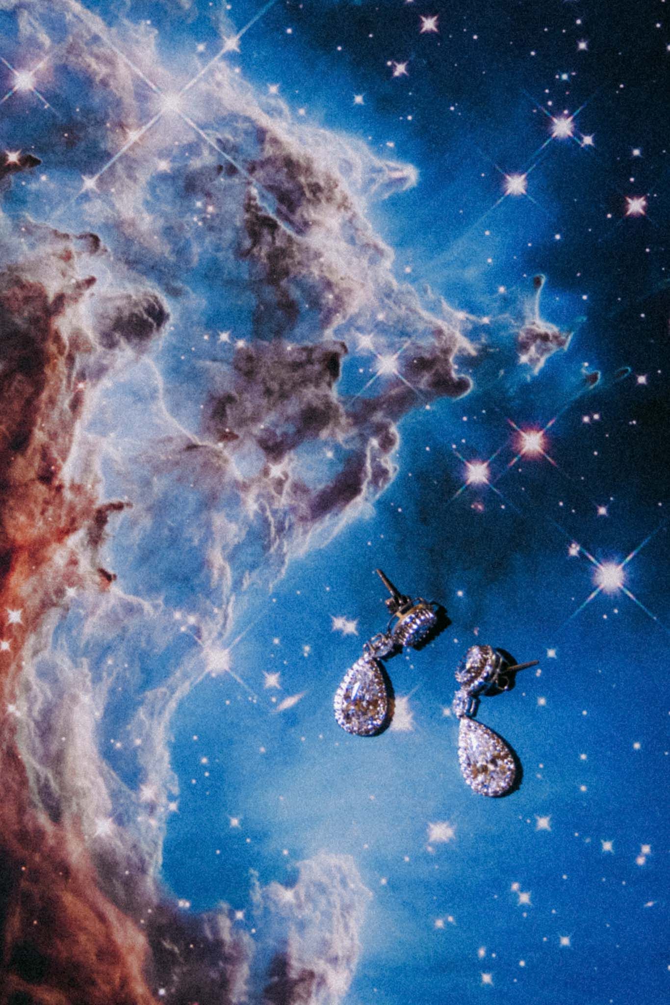 A stunning composite image shows the Carina Nebula's swirling blue and red cosmic clouds with twinkling stars in deep space.