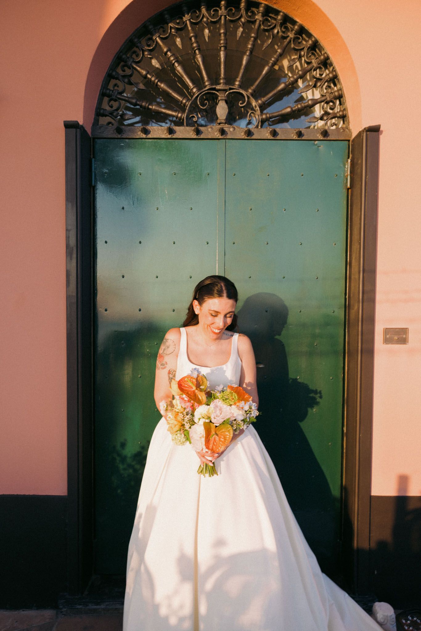 A series of photos showing a person in a white wedding dress looking down at their gown in a vintage-style setting.