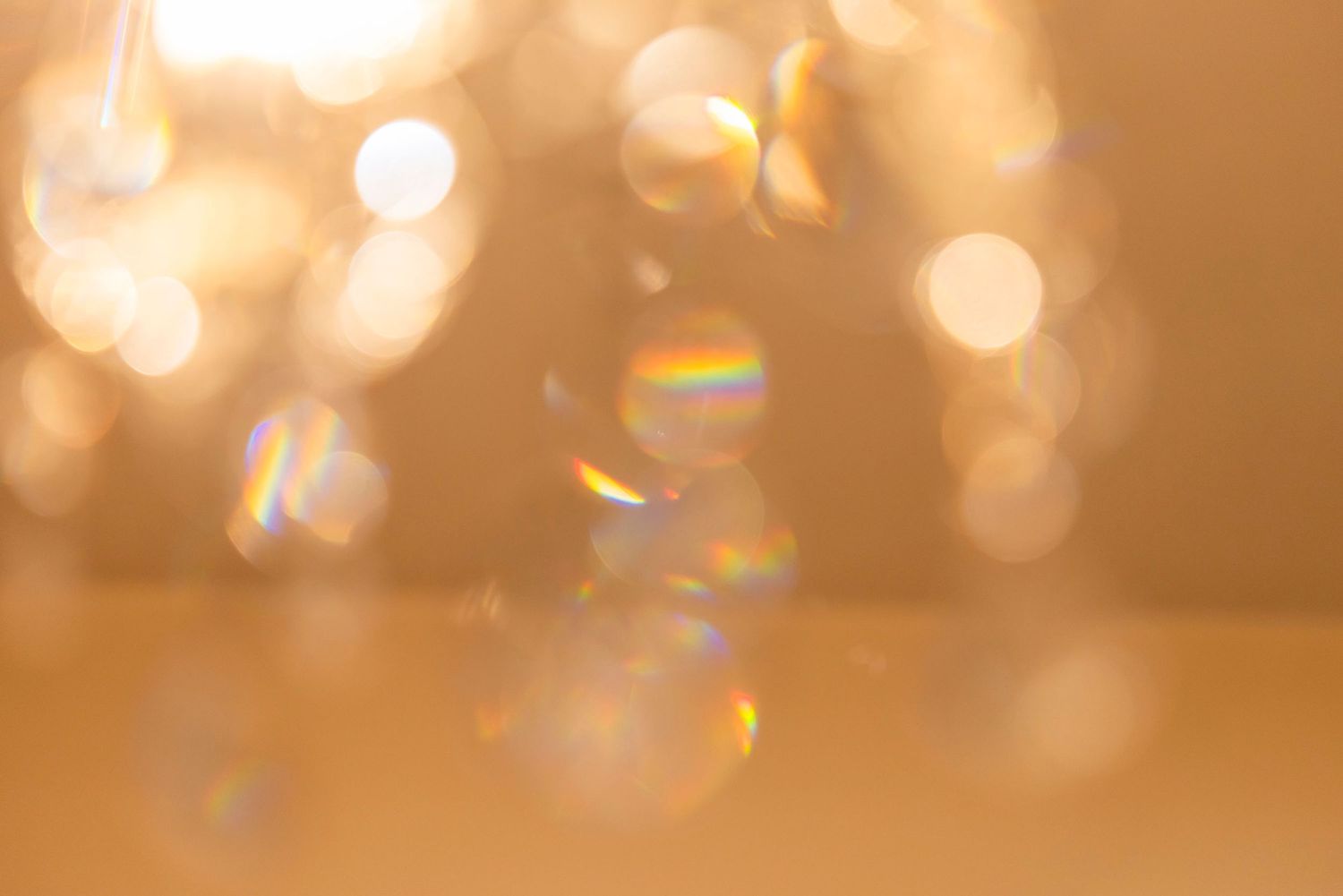 Soft golden bokeh lights creating a warm, dreamy background effect.
