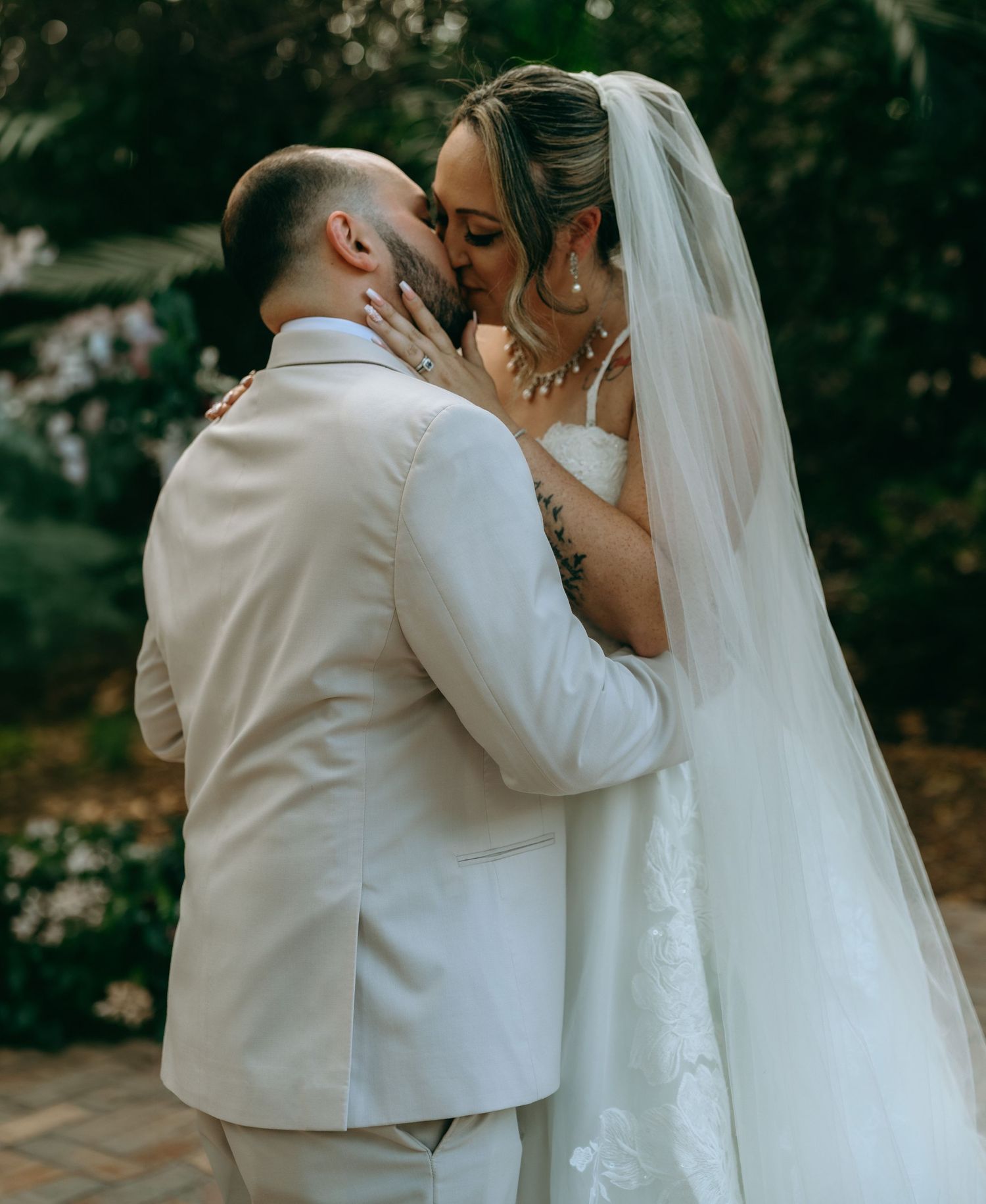 Romantic wedding couple sharing intimate kisses in a series of tender moments captured in outdoor portraits.