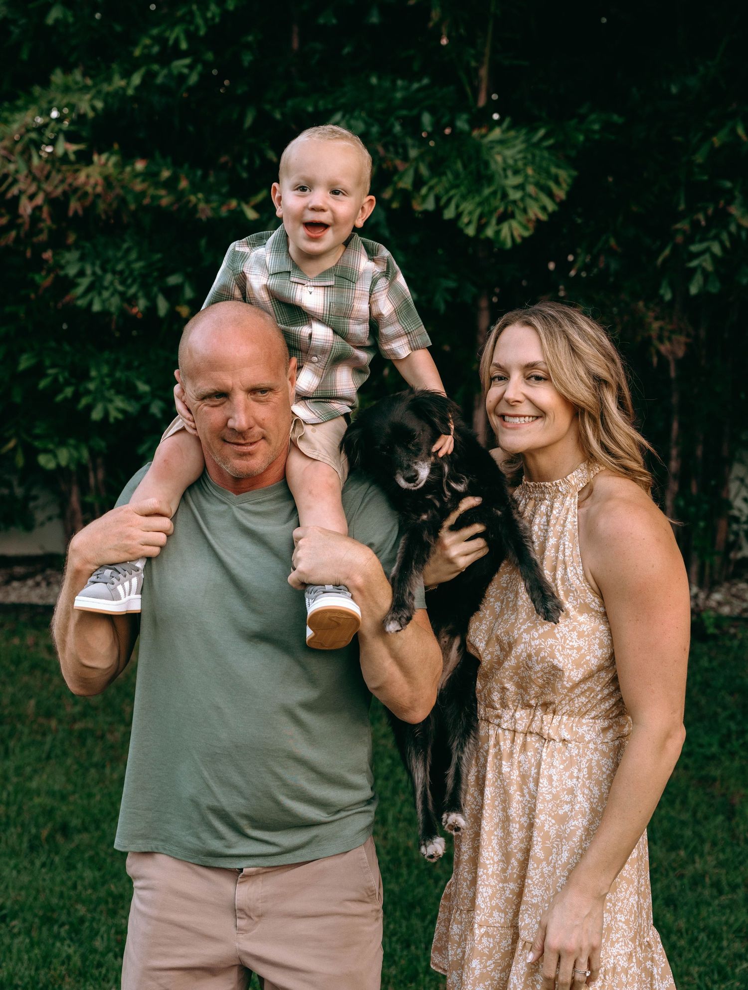 Playful family moments captured on a lush green lawn.