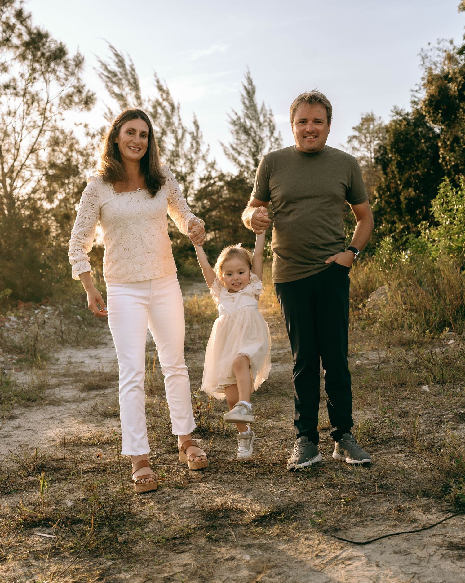 Casual family photos taken on a natural trail during golden hour.