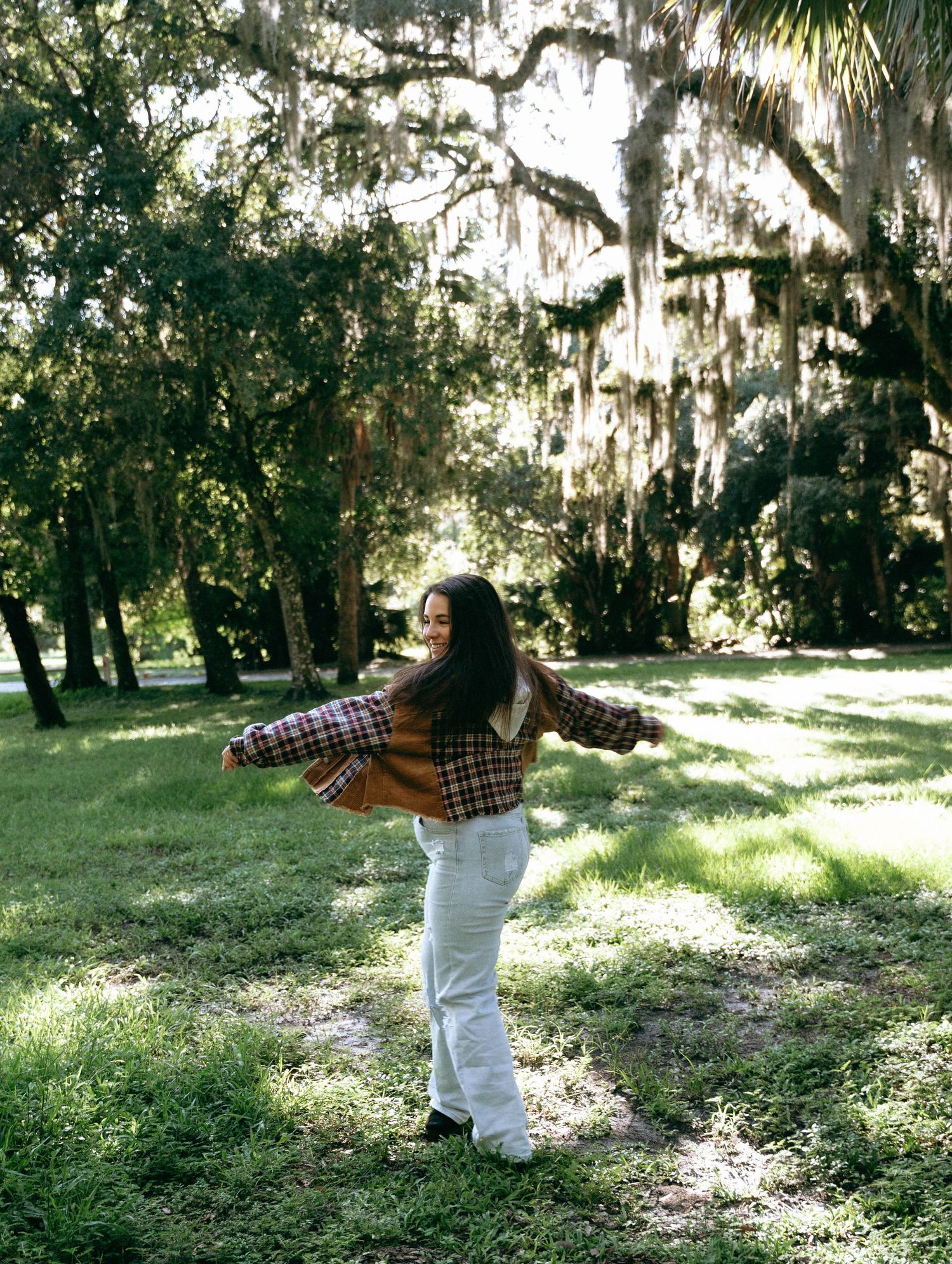 Dynamic dance movements captured in sequence against a natural forest backdrop.