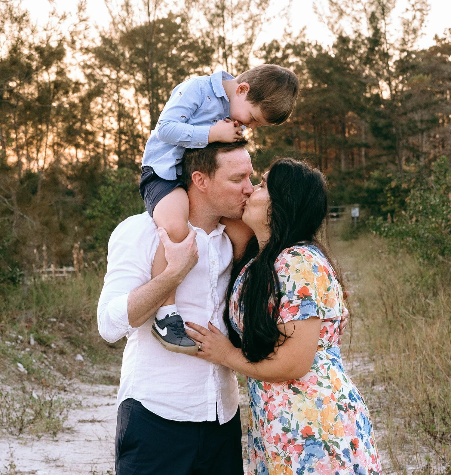 Sweet family interactions and embraces photographed during a sunset photo session.