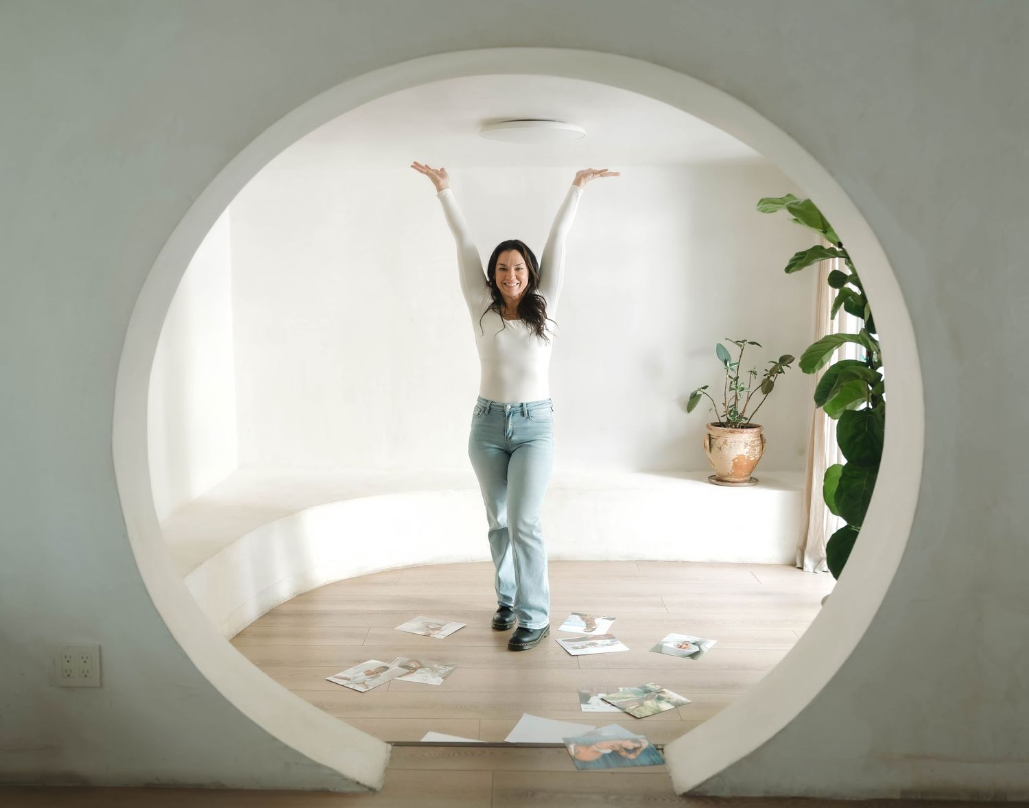 Series of artistic shots through an oval window frame showing movement in a bright interior space.