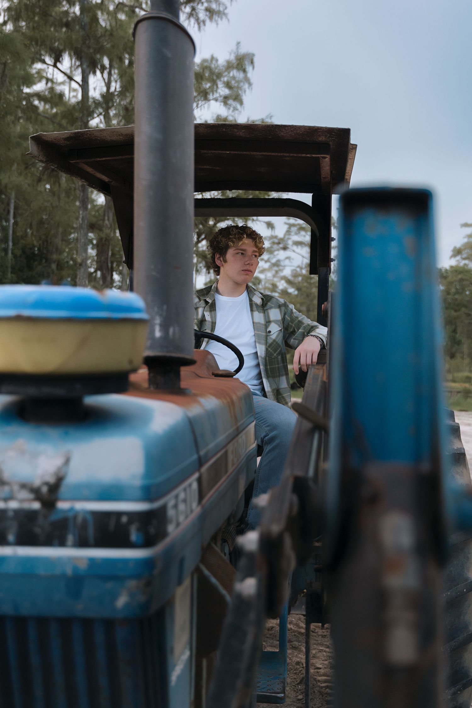 Artistic shots taken near blue industrial equipment with blurred background effects.