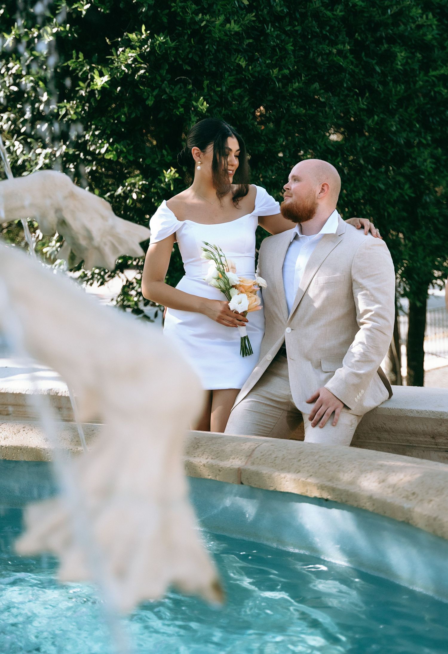 Sequence of wedding photos showing couple in white attire posing by a swimming pool on their special day.