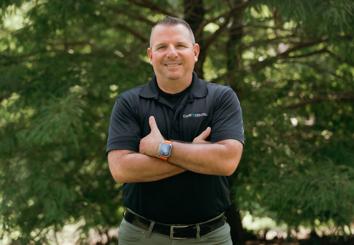 Professional outdoor headshots featuring someone in branded company attire.