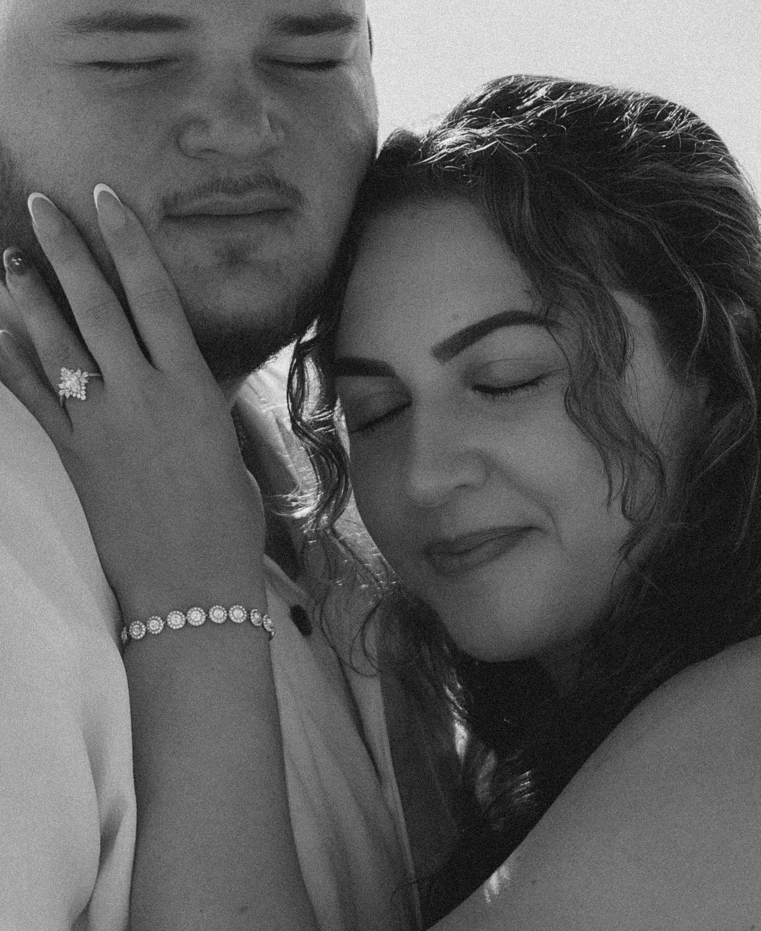 Intimate black and white close-up portraits of a couple.